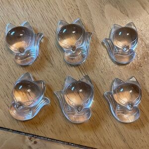 Carved clear quartz foxes